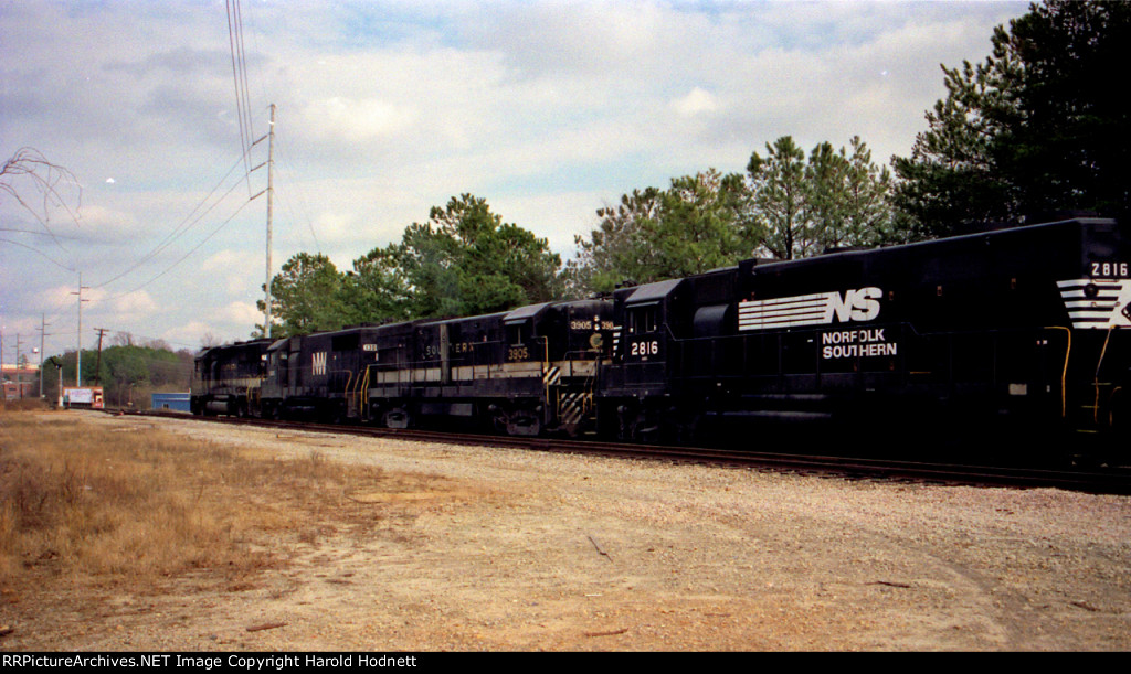 A diverse train of locomotives heads northbound